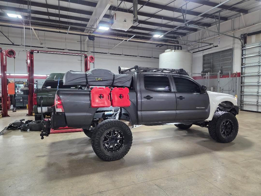 2015 Toyota Tacoma — STAPLL 6x13 racks and 56L Hard Case on track hardware