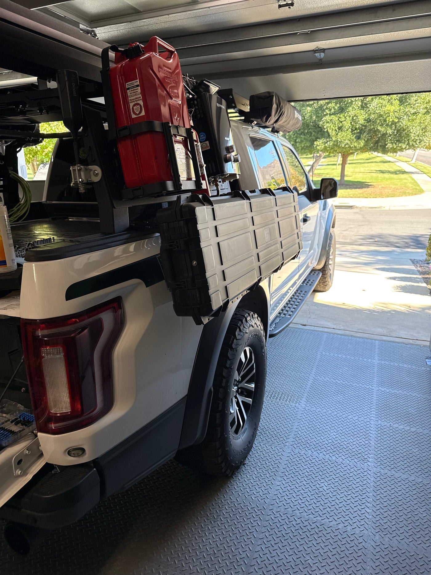 2019 Ford F150 Raptor with STAPLL 6x7 Fender Racks and a 56L Hard Case, installed alongside an existing overland bed rack
