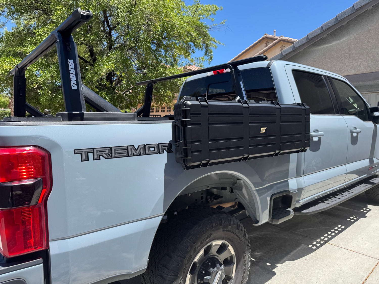 ford f350 with stapll fender rack case and bedside molle panel mounted on tonneau cover